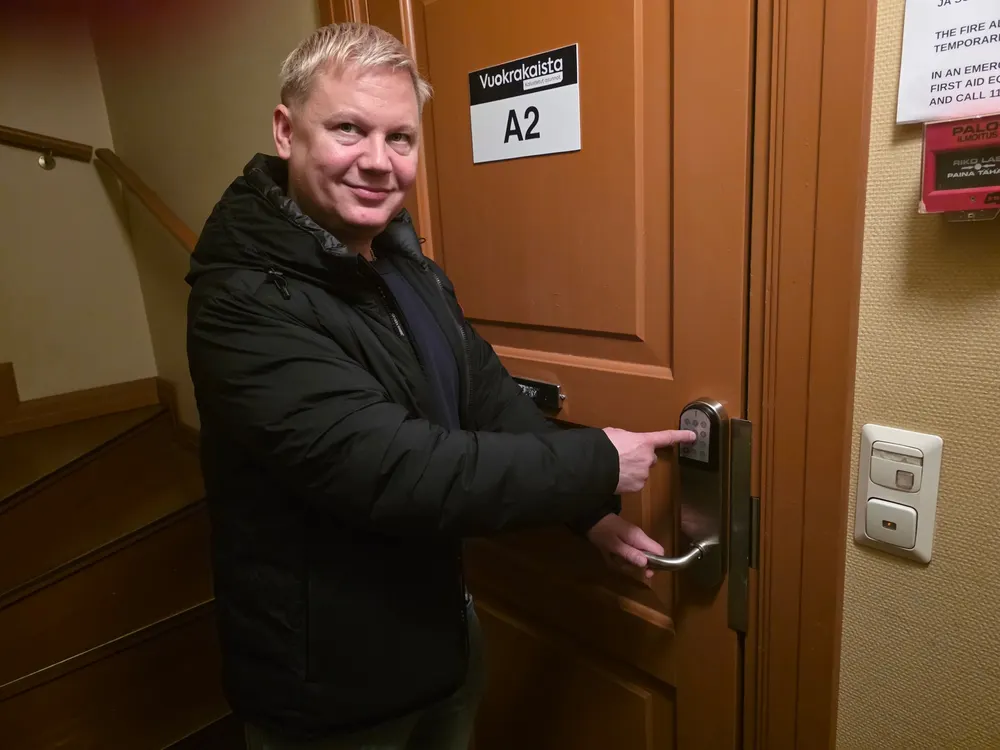 Janne Immonen testing the keypad lock of apartment A2 at Korpela